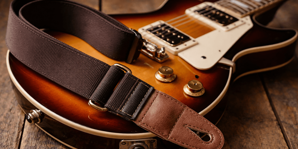 Guitar strap attached to an guitar